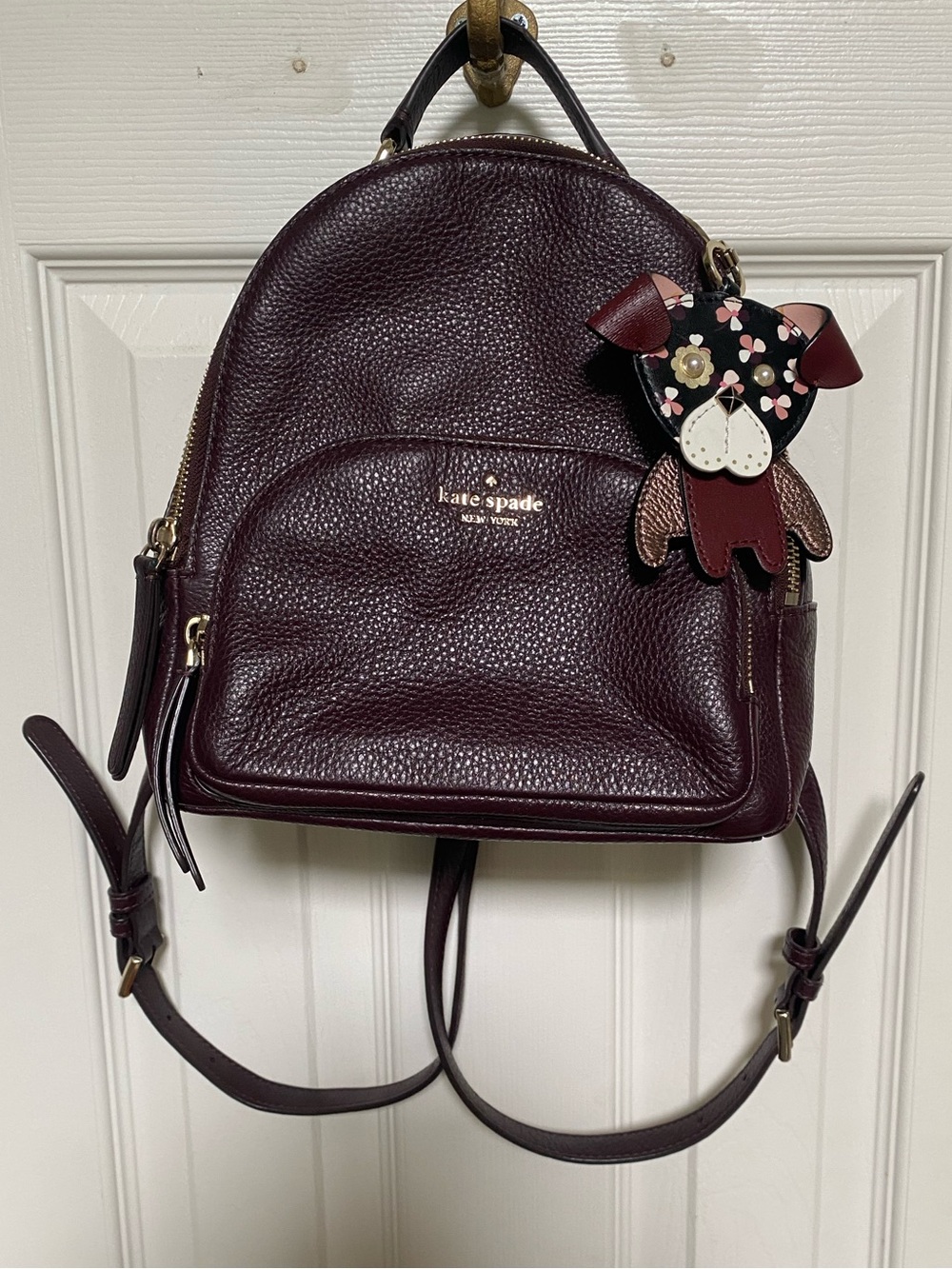 Kate Spade New York Jackson Leather Backpack & Floral Pup Charm in Cherrywood